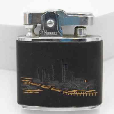 Lighter: The lighter features a refined oil refinery scene with metallic accents.