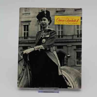 Back cover of "Her Most Gracious Majesty Queen Elizabeth II: Volume One": The back cover has a small box with the text "Her Most Gracious Majesty Queen Elizabeth II: Volume One." It has a large black-and-white image of Queen Elizabeth riding a horse.