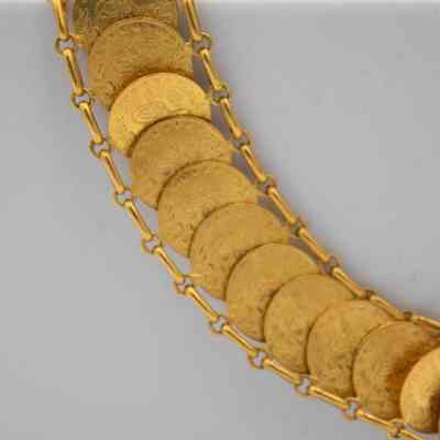 Gold coin bracelet given to Mrs. Jessie Jordan by King Farouk I of Egypt.: Up close image of the chained gold coin bracelet. The coins are 50 Kurush gold coins from Turkey that were in circulation from 1942-2013.