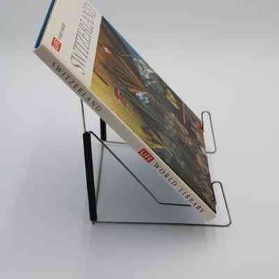 Book Spine of “Switzerland”: The spine of “Switzerland” features the book title and creator of the book.