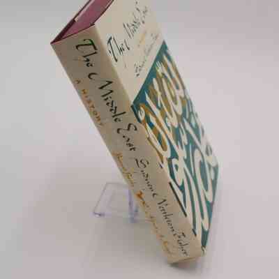 Spine of "The Middle East: A History": The spine is white with teal and yellow text featuring the title, author and publisher, Borzoi Books.