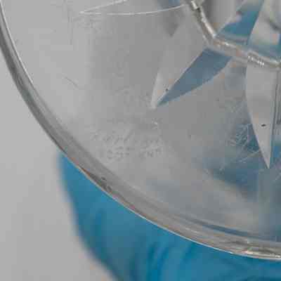 Engraving in bottom of vase: The bottom of the glass vase has "Edinburgh; Scotland."