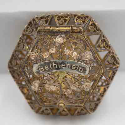 Metal rosary box: An intricately designed metal box marked "Bethlehem."