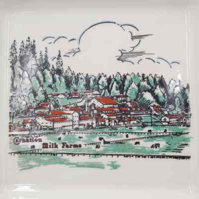 Closeup of painting on ashtray: Close up of painted scene depicting the Carnation Milk Farms and Harvard's crest/motto "Veritas" at bottom.