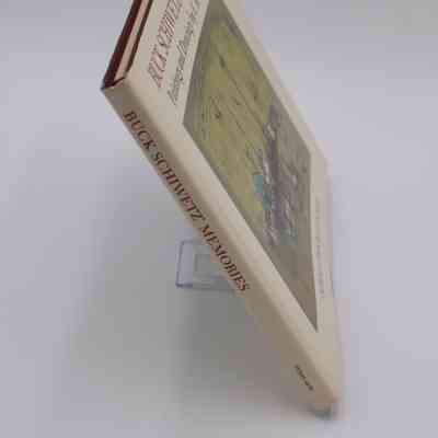 Book Spine: The spine of “Buck Schiwetz' Memories” features the book title and publisher.