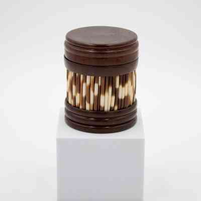Covered olive wood round box inlaid with porcupine quills.: Image of the round olive wood box with lid and inlaid with porcupine quills around the base.