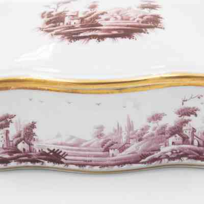 Cigarette box: The white ceramic cigarette box features a gold rim with a burgundy pastoral scene.