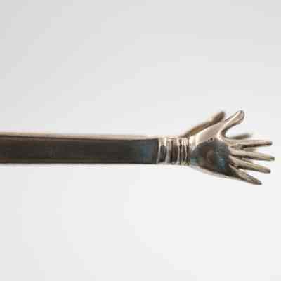Hands on tongs: The hands at the ends of the tongs.