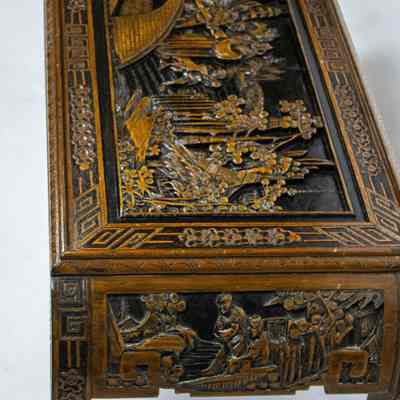 Side and top of coffee table: The ornate wooden coffee table features intricate carvings and elegantly arched legs, showcasing skilled craftsmanship.