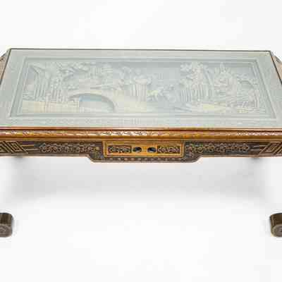 Coffee table: The Hong Kong coffee table features intricate carvings and elegant arched legs, showcasing exquisite craftsmanship.