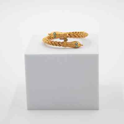 Gold Bracelet with Snake Heads at Either End and Turquoise Eyes