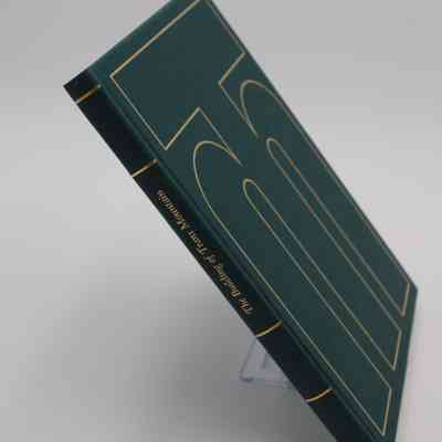 Spine and front cover of "The Building of Trans Mountain": A view where both the covers "T" and "M" logo, as well as the spine with the title, are visible.