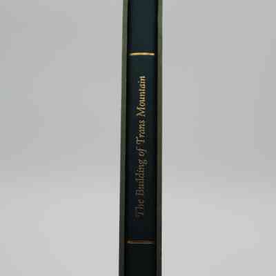 Spine in case of "The Building of Trans Mountain": The spine says "The Building of Trans Mountain" in gold text.