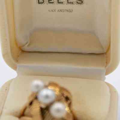 Inside the lid of the white case.: Image of the white case stamped with "'TEXAS OLDEST JEWELERS' ESTABLISHED 1852 BELL'S SAN ANTONIO" in black ink on the inside of the lid.