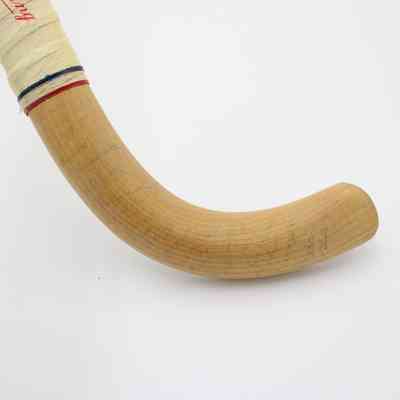Toe of hockey stick: The backside of the toe has lightened signatures.