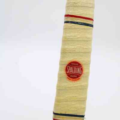 Spalding branding: The head of the hockey stick has white wrapping with the Spalding brand logo, "made in England."