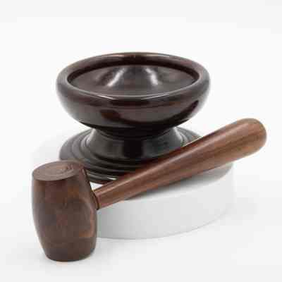 Mahogany nut bowl and mallet: A polished mahogany nut bowl is displayed alongside a matching wooden mallet.