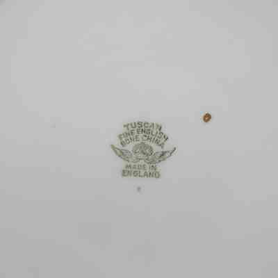 Logo on back of plate: The white plate has a green logo stamp with, "Fine English Bone China; Made in England."