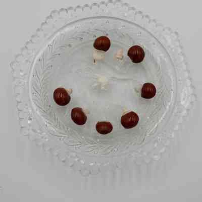 Hexagonal Crystal Dish with Lucky Red Seeds Topped by Miniature Carved Ivory Elephants