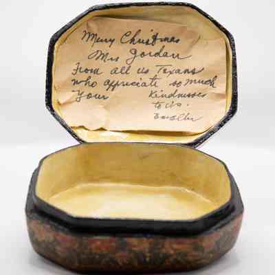 Note inside box: A handwritten note inside the box says, "Merry Christmas Mrs. Jordan, from all us Texans who appreciate your kindness to us so much. - Sue Ellen"