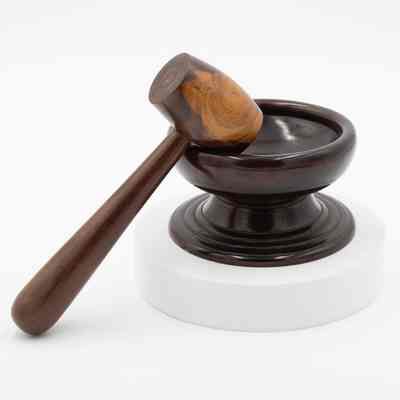 Mahogany nut bowl and mallet: A mahogany nut bowl with a wooden mallet.