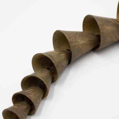 Camel bells: Nine camel bells hang in succession, each decreasing in size.