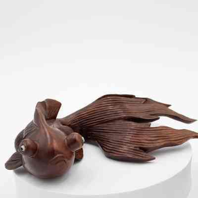 One of the carved red wood goldfish.: Image of one of two carved red wood goldfish.
