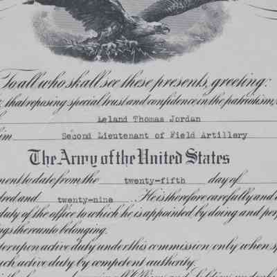 Document Middle: Photograph of the middle of the document. Below the title top insignia from the President is a black and white depiction of a bald eagle in flight.