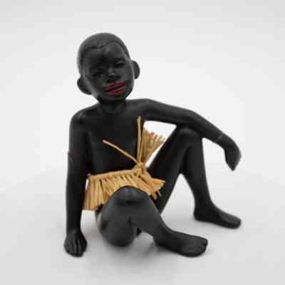 Black Ebony Figurine of Boy Sitting with Grass Skirt
