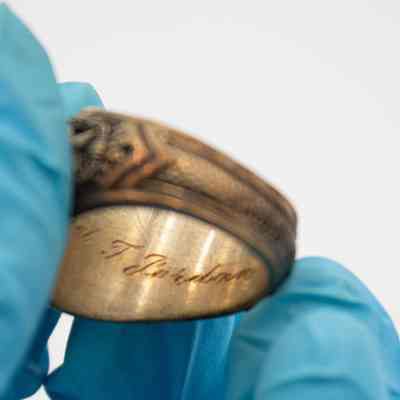Inside of L.T. Jordan's 1929 class ring from Texas A&M University.: Up close image of the inside of L.T.'s class ring. It is engraved with his name. "Leland T. Jordan" in cursive.
