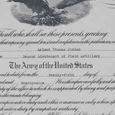 Document Middle: Photograph of the middle of the document. Below the title top insignia from the President is a black and white depiction of a bald eagle in flight.