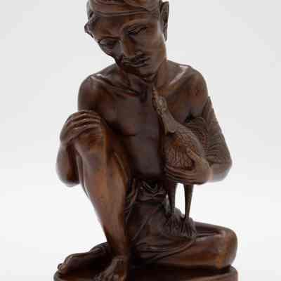 Carved Wooden Seated Cockfighter with Cock Figurine