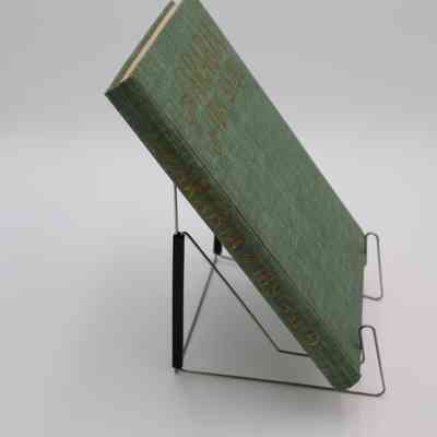 Book Spine: The spine of “The Arabia of Ibn Saud” features the book title.