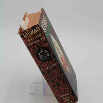 Spine of "Kuwait and Her Neighbors": The spine is black with a red brick pattern. The title is featured in horizontal text.