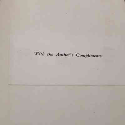 Inside cover of "Kuwait and Her Neighbors": A small card glued into the front cover stating "With the Author's Compliments."