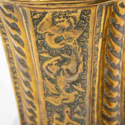 Cachepot birds: This face of the cachepot has a flower framing two birds.