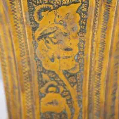 Cachepot birds: This face of the cachepot has a flower framing two birds.
