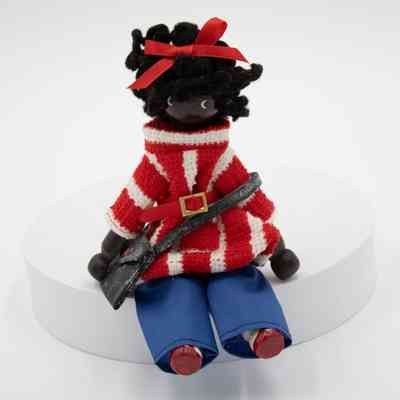 Black Ebony Figurine of a Girl in a Red Striped Sweater and Blue Pants