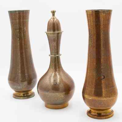 Peacock urn and matching vases: The image shows a tall brass red peacock-covered urn flanked by two matching vases.