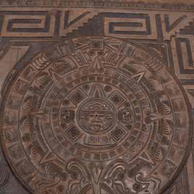 Aztec sundial on leather mat: The tooled leather desk mat features an intricate Aztec sundial and elegant archer details.