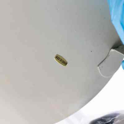Bottom of doll: The bottom of the doll is solid white with a gold "Made in Taiwan" sticker.