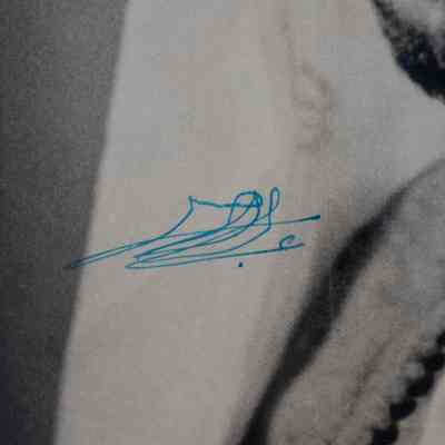 Blue signature: A signature, in bright blue ink, in Arabic "Emir Jaber al-Ahmad al-Sabah"