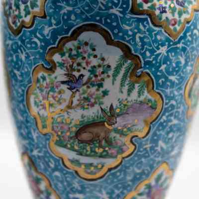 Vase with rabbits: The vase features a blue enamel with delicate, painted scenes of nature.