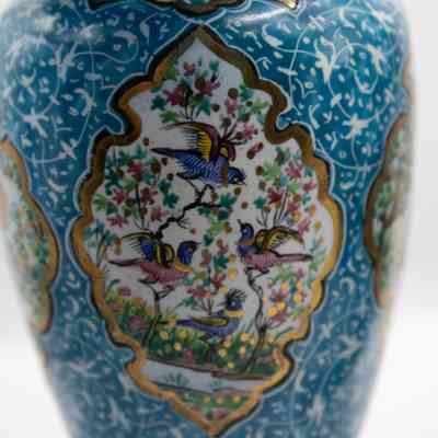 Vase with birds: The small blue enameled vase features intricate bird and floral decorations framed in gold.