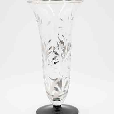 Crystal vase given to Mrs. Jessie Jordan by Mr. L.T. Jordan for their 25th wedding anniversary.: Image of the crystal vase with silver leaf, etched flower design, and black base.