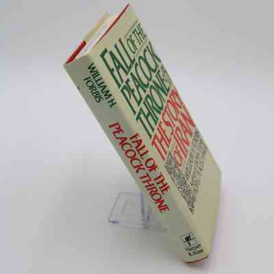 Spine of “Fall of the Peacock Throne”: The book spine of “Fall of the Peacock Throne” has the author's name and book title. It also features the logo and name of the publisher.