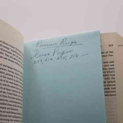 Note Inside Book: Inside “Fall of the Peacock Throne” on page 213 is a blue note. The note reads "Persian Rugs, (illegible) Pages 213, 214, 215, 216 __"
