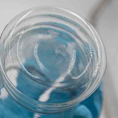 Seam around bottom: Bottom of glass with seam, indicating it was molded.