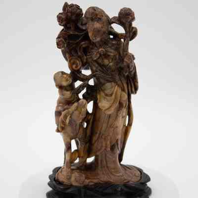 Carved Stone Scene of Woman with Child Riding Animal