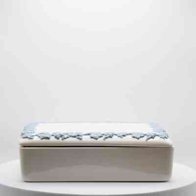 Cigarette box: A white Wedgwood Queen's Ware box features blue ivy details delicately adorning its lid.
